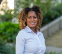 Alisha Williams | Assistant Director, Institutional Excellence & Opportunity Alisha Williams smiling at camera, outside of a Tulane Campus building