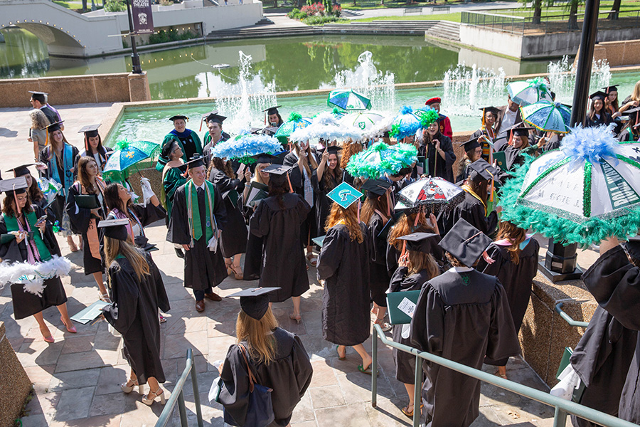 Parasols in the crowd after the graduation ceremony