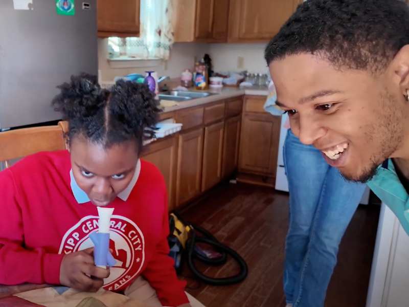 Two New Orleans kids taking breathing tests