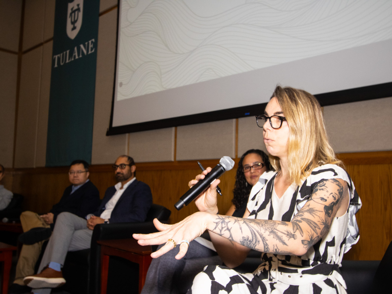 A panel discusses AI in Diboll Auditorium