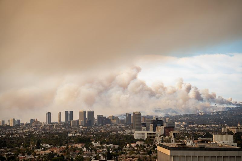 A city skyline covered in smog and smoke.
