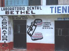 Dental lab storefront with hand-painted sign 'Bethel'