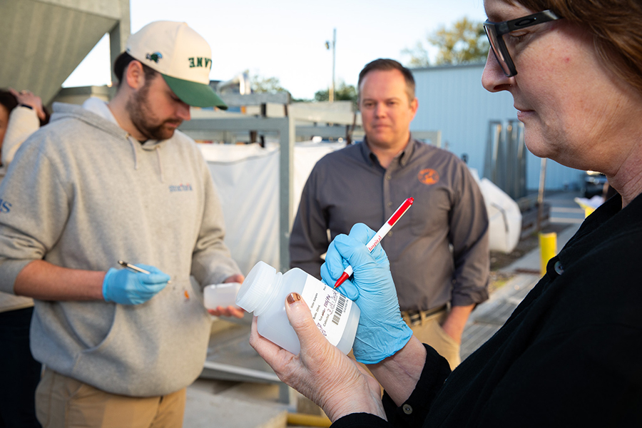 Dr. Rustin Reed and students evaluate and mark water containers