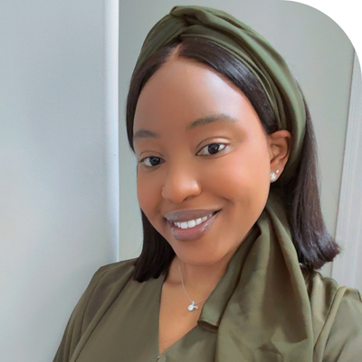 young black lady headshpt in olive green top and olive green headtie