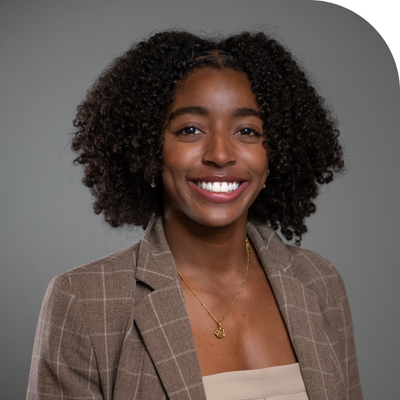 black young lady in brown suit headshot