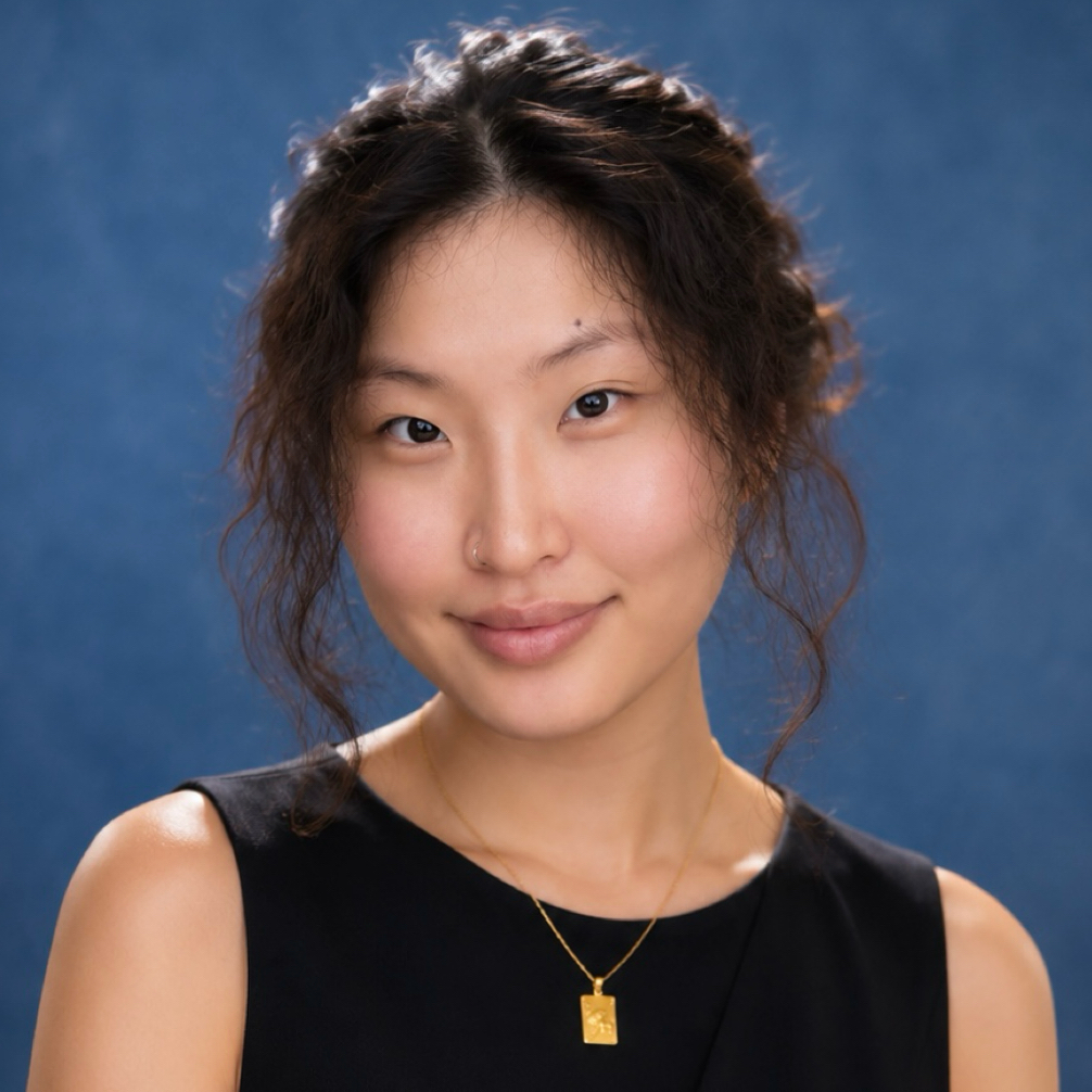 young asian lady in black top smiling