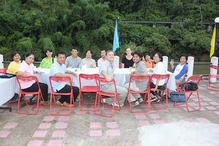 Field station research team. IPSR faculty, Tulane faculty and students enjoying dinner overlooking the River Kwai