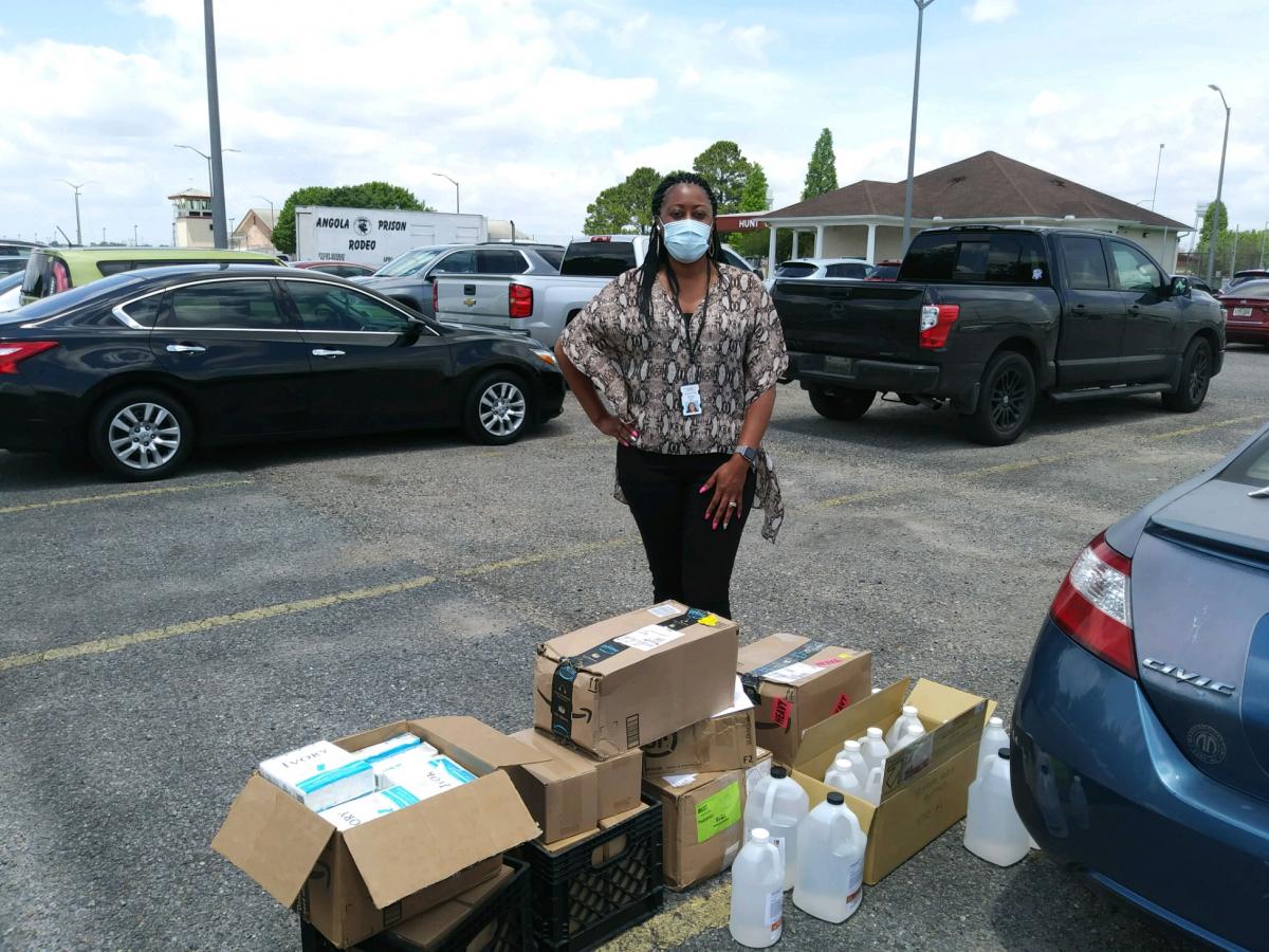 Photo of Associate Warden Burks with the supplies