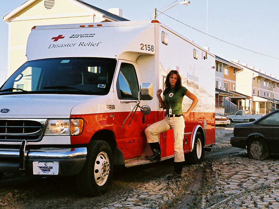 Rebecca Thomley in front of a relief van