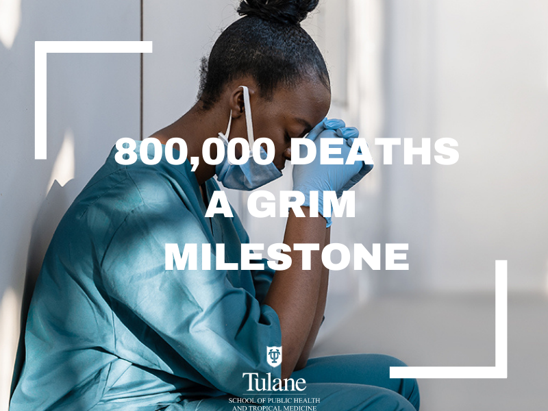 Exhausted nurse or doctor, hands folded, eyes closed, text overlay: 800,000 a grim milestone