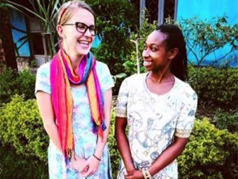 Returned Peace Corps Volunteer Caitlin Riddle with friend in Uganda