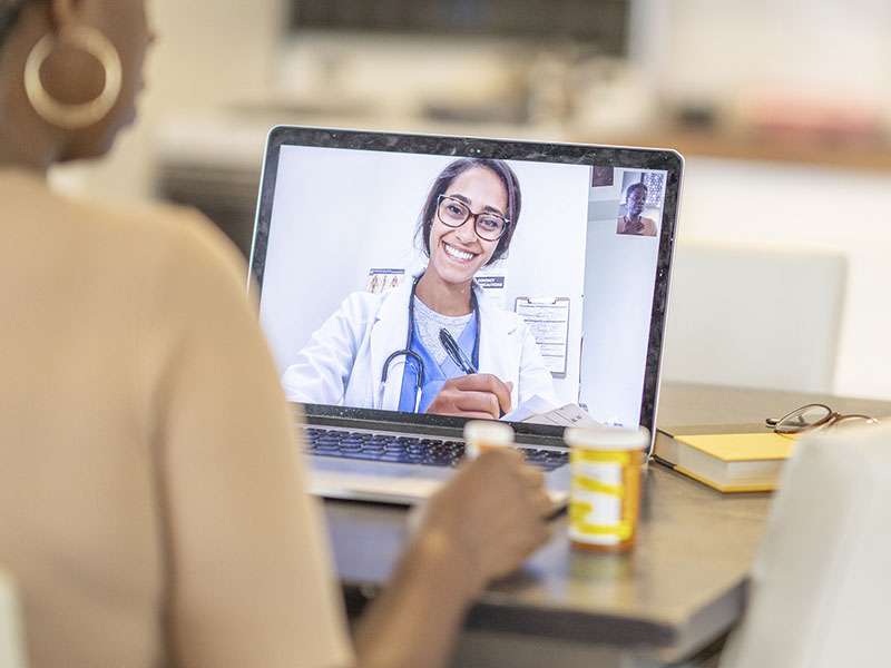 Telemedicine consultation with doctor on computer screen and patient in speaking to doctor. Photo by kamleshverm, courtesy of Pixabay.com.
