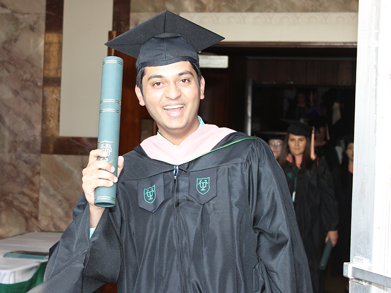 Alumnus Jaffer Shariff with MPH diploma on graduation day
