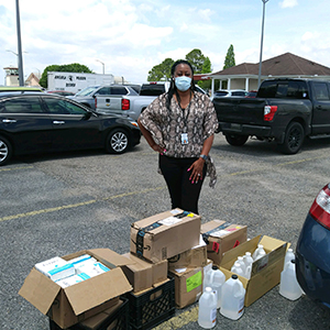 Photo of Associate Warden Burks with the supplies