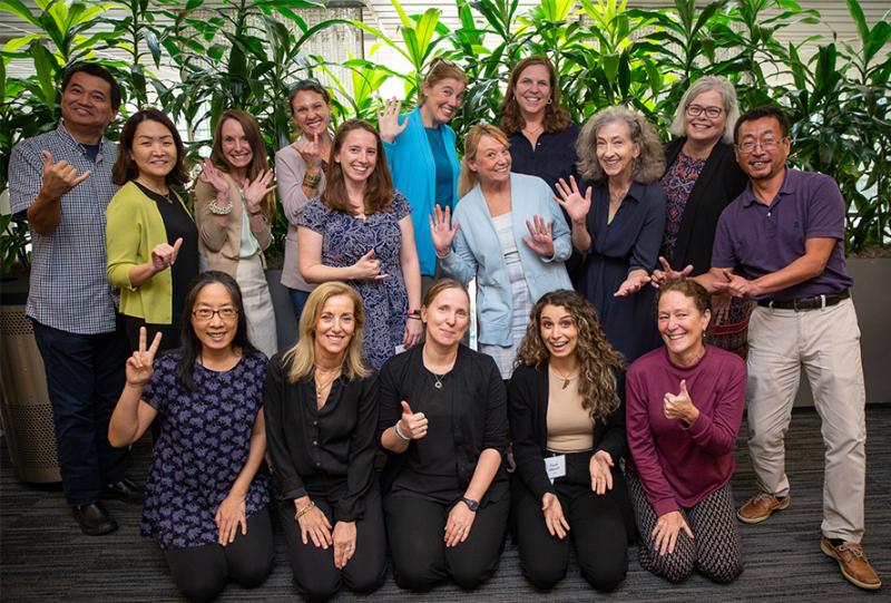 Jobs at Weatherhead School of Public Health A group of faculty smiling and makng peace signs
