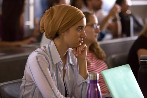 Master of Public Health programs | School of Public Health and Tropical Medicine Student with hand to chin looking pensively during a meeting