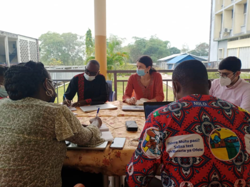 A group takes part in a planning session around a table