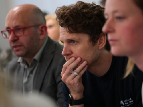 Andrew Ryan listening to a presentation