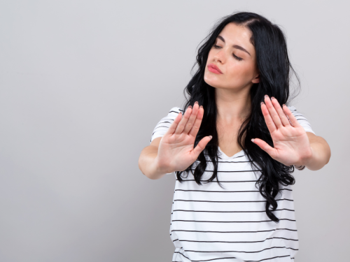 A woman gesturing rejection