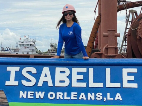 Isabelle Smith standing aboard the Isabelle