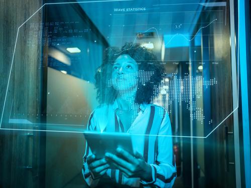 Transforming Public Health with AI in the Celia Scott Weatherhead School of Public Health and Tropical Medicine Woman using AI in office or academic setting