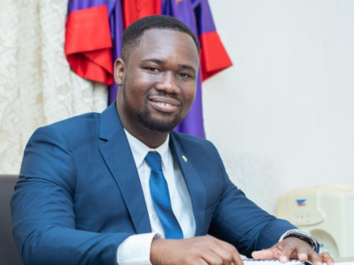 Student Ambassador: Codjo Dadje | Celia Scott Weatherhead School of Public Health and Tropical Medicine Codjo Dadje sitting at a desk smiling