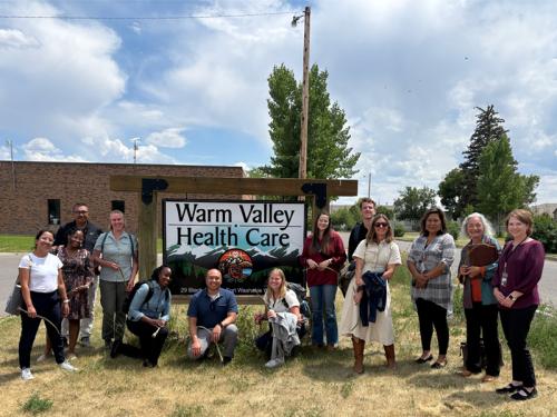 Public Health Leadership for Sustainable Development in the Age of Disruption Group of student and instructors at a community health center in Wyoming, with big sky in the background