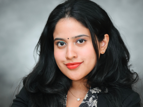 Student Ambassador Sneha Kannan | Celia Scott Weatherhead School of Public Health and Tropical Medicine Sneha Kannan, looking at camera, smiling, dark hair frames her face