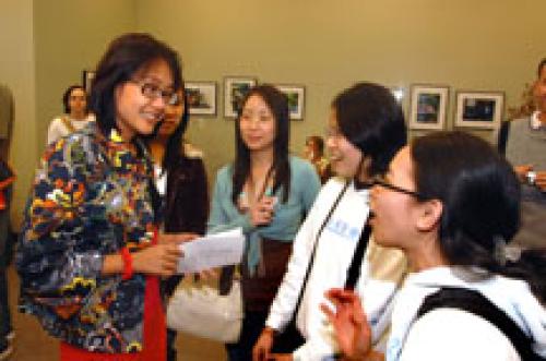 students engaged in interesting conversations with their professor