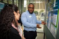 Alex Kimbrough discusses his poster at the 2025 Delta Omega poster competition