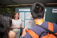 Ellie Hood discusses her poster at the Delta Omega poster competition