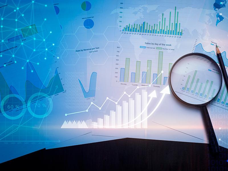 Department of Biostatistics and Data Science | Tulane University School of Public Health and Tropical Medicine Image of graphs, stats, wit magnifiying glass and pencil