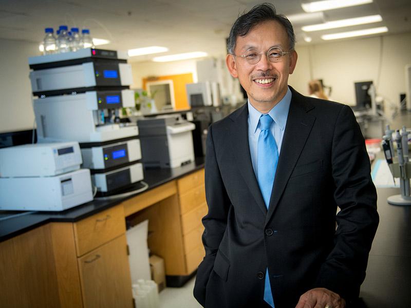 Photo of TUTSI Director, Dr. Jiang He, in lab on Tulane Campus