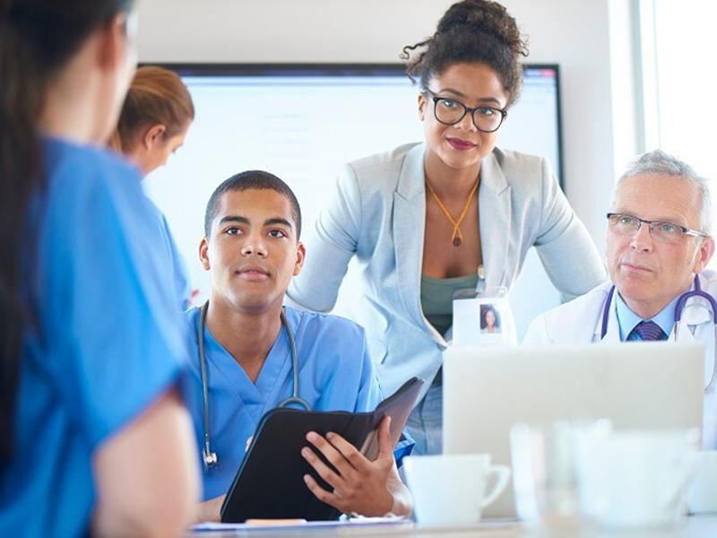 Diverse group of healthcare professionals with computers