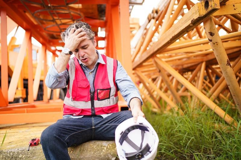 A worker struggling with the heat outside