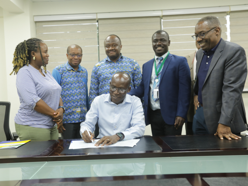 Dean LaVeist together with other officials at Ensign Global signing