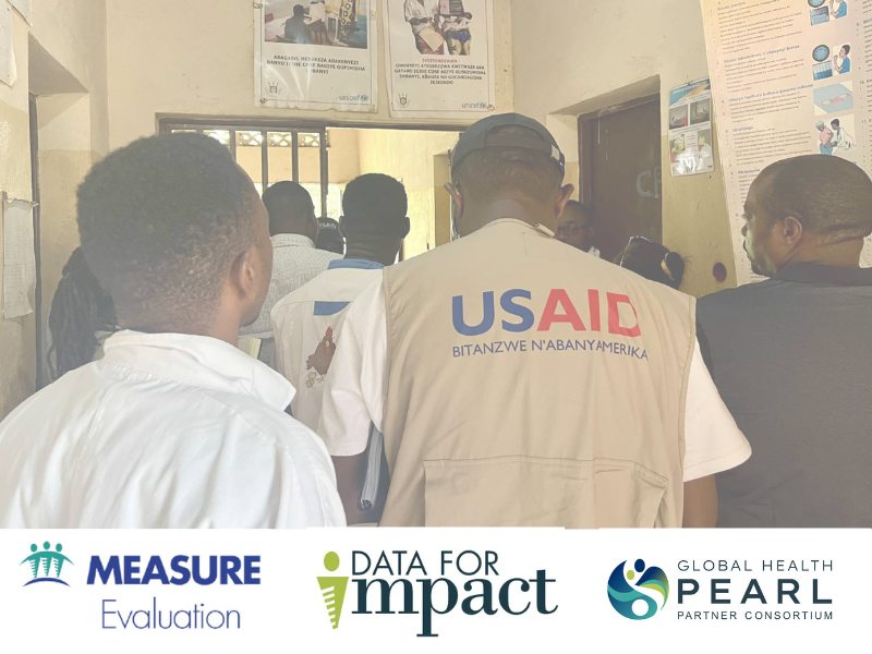 Data for Impact work being done on the ground. A worker with a USAid vest has his back turned.