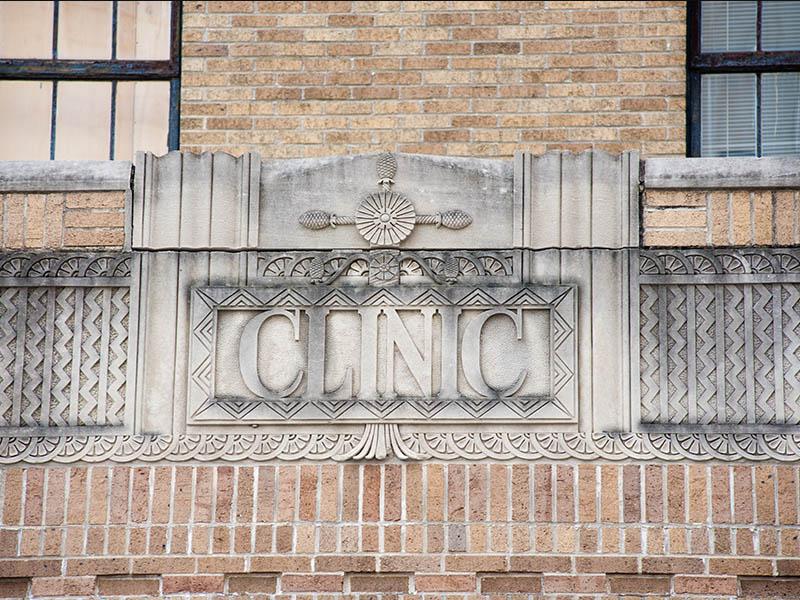 Bas relief of word "Clinic" over doors of Tulane School of Medicine old building