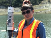 Environmental Health Doctoral Student Katie Vigil holding a water testing device