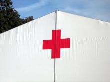 Red cross on white tent