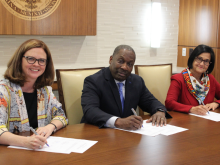 Dean LaVeist signing agreement at Loyola University 