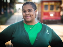 LeShawn Simplis-Barnes in front of a streetcar on Canal Street