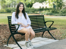 Robyn Sanders sitting on a park bench