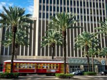 Streetcar on Canal Street in front of SPHTM building
