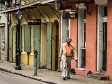 Man walks alone in New Orlean's French Quarter