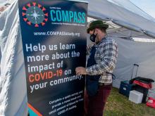 Andrew Poland of the School of Public Health and Tropical Medicine sets up a testing tent for the COMPASS Study at the Salvation Army Family Store on Jefferson Highway.