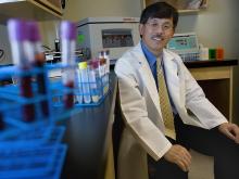 Jiang He in lab setting, He is department chair of epidemiology