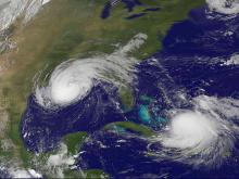  This satellite image was captured on September 1, 2008 from Geostationary Operational Environmental Satellite (GOES-12). In the image, Hurricane Gustav was just crossing the Louisiana coast, while Tropical Storm Hanna was spinning near the Turks and Caic