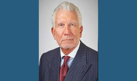 Bernard Panetta headshot, wearing a pinstripe suit