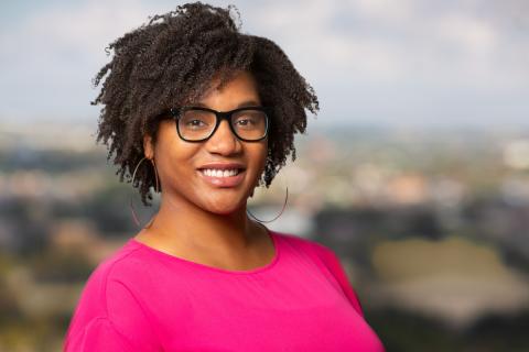 Caryn N. Bell, smiling at camera, headshot, wearing suit